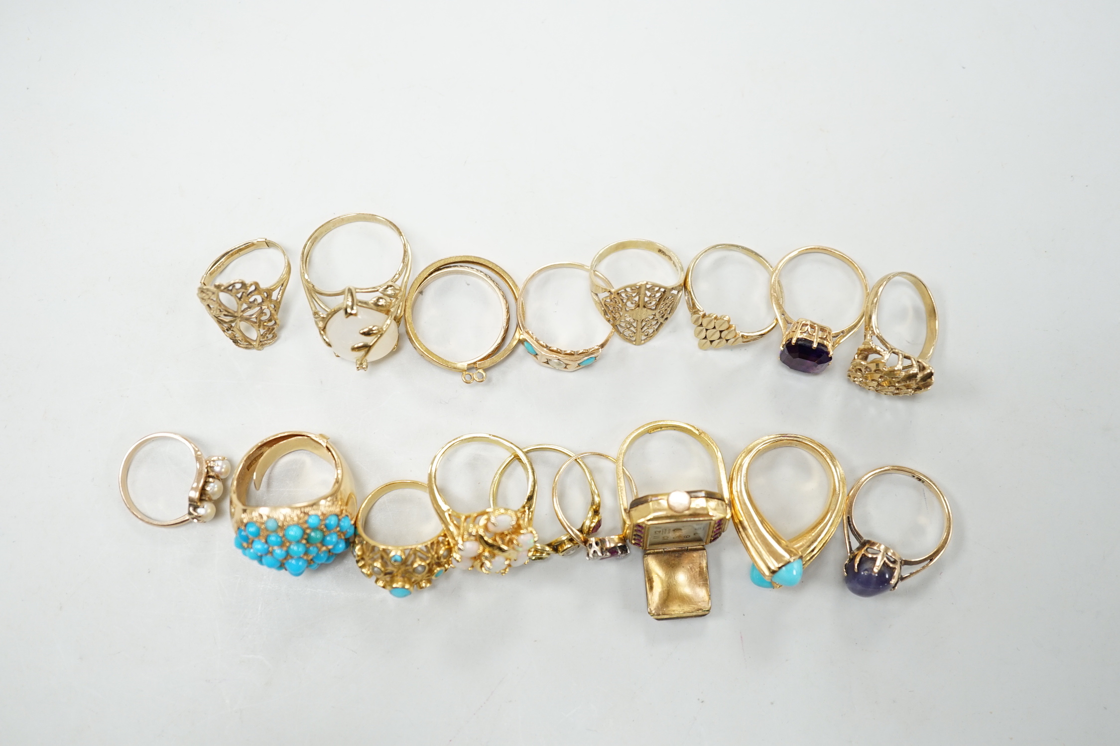Three 18ct and gem set rings including star sapphire, turquoise and pearl and ruby and diamond three stone, five 9ct gold rings and a 9ct gold pendant mount and nine other rings including ring watch and Middle Eastern tu